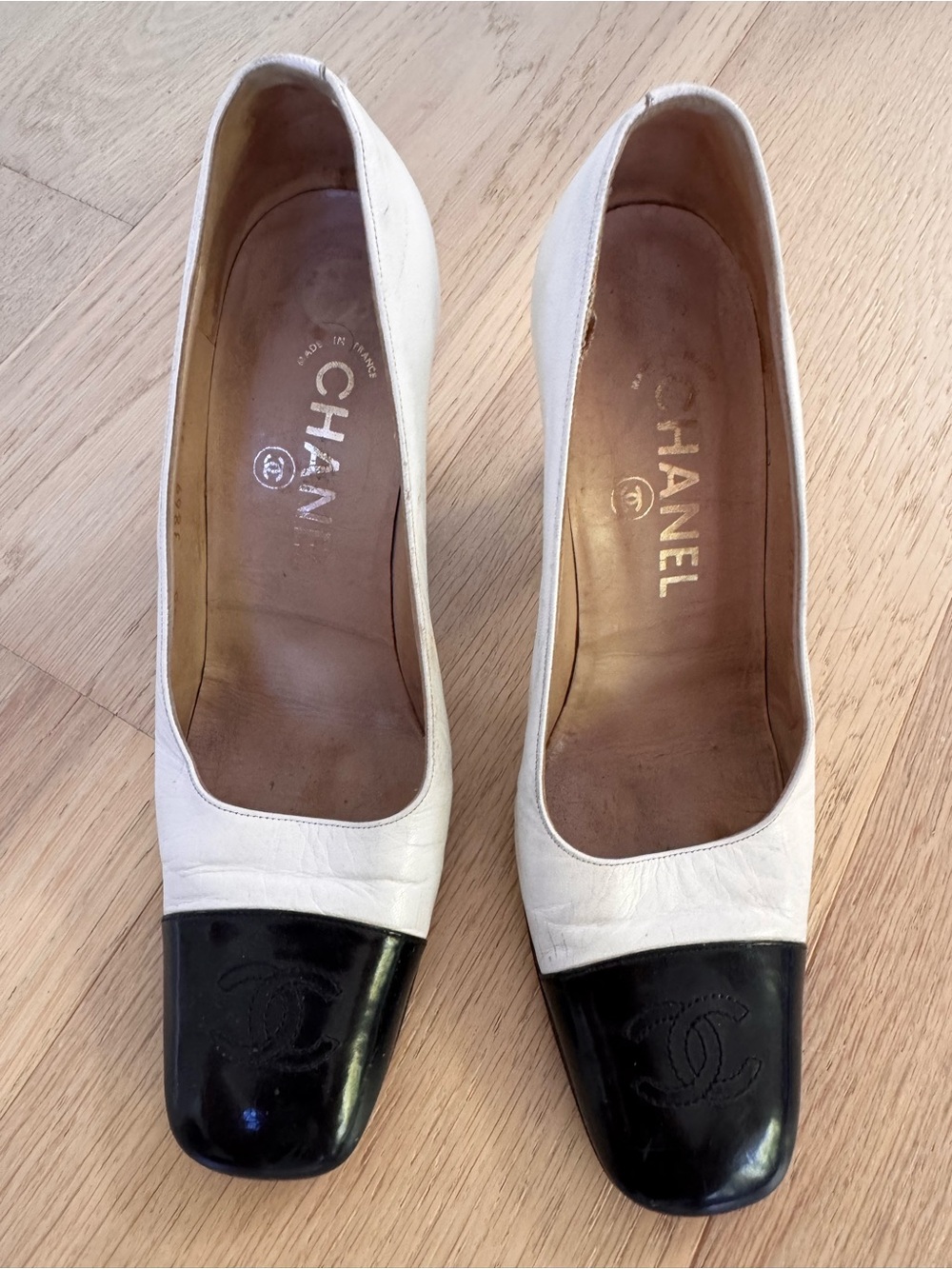 CHANEL White Leather Pumps with Black Cap Toe